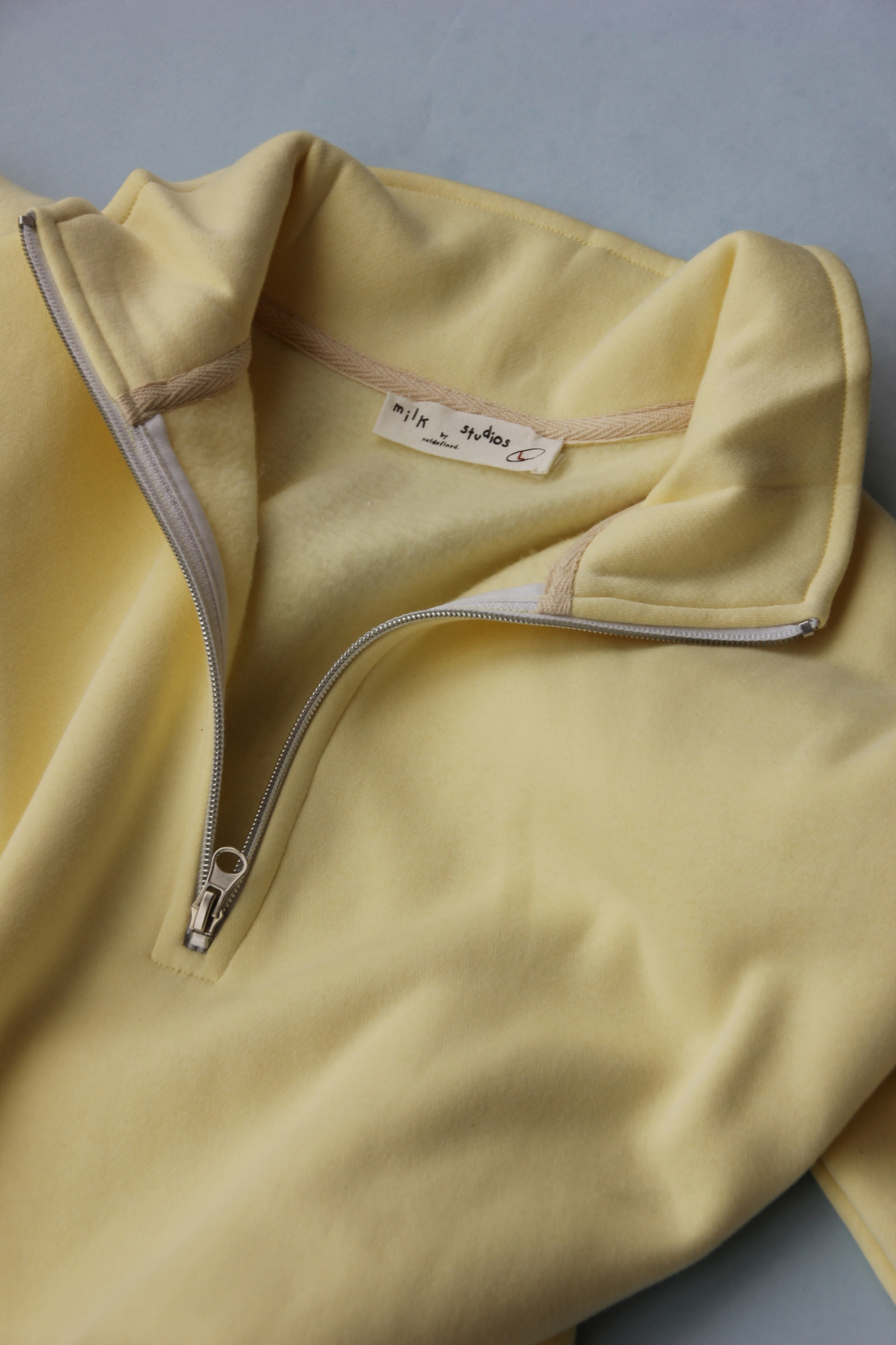 Butter Cream Quarter Zipper